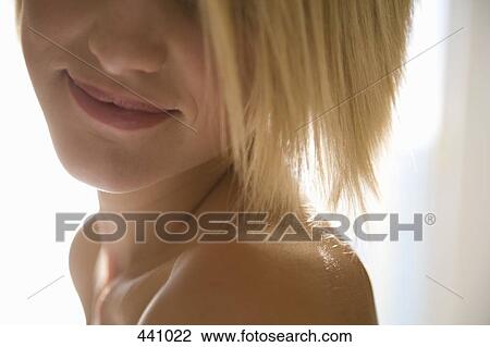 Close-up of a young woman with bare shoulders View Large Photo Image Stock Image - Close-up of a young woman with bare shoulders. Fotosearch