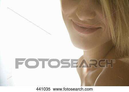 Young woman with blond hair smiling View Large Photo Image Stock Photography - Young woman with blond hair smiling. Fotosearch