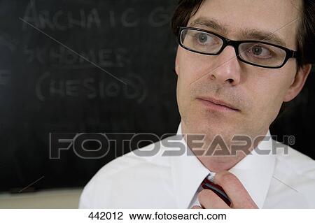 Lecturer in front of blackboard View Large Photo Image Stock Image - Lecturer in front of blackboard. Fotosearch