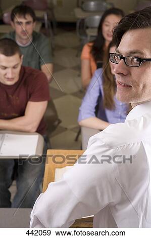 Stock Photo - Lecturer standing in front of students. Fotosearch