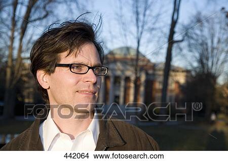 Lecturer standing outside of university View Large Photo Image Picture - Lecturer standing outside of university. Fotosearch