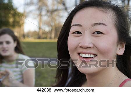 Portrait of a university student sitting on grass View Large Photo Image Stock Photo - Portrait of a university student sitting on grass. Fotosearch