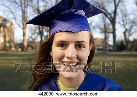 Portrait of a woman in a graduation gown and mortar board View Large Photo Image Stock Image - Portrait of a woman in a graduation gown and mortar board. Fotosearch