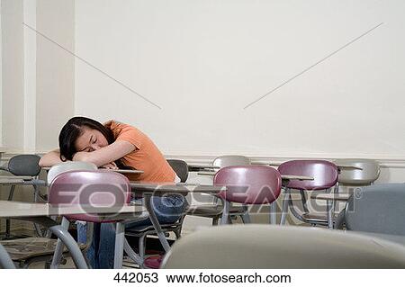 Student sleeping on her desk View Large Photo Image Stock Image - Student sleeping on her desk. Fotosearch