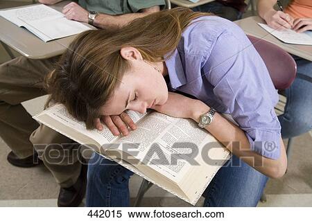 Student sleeping on her desk View Large Photo Image Stock Photography - Student sleeping on her desk. Fotosearch