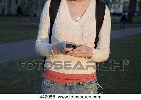 Student using mobile phone View Large Photo Image Stock Photo - Student using mobile phone. Fotosearch