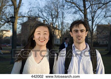 Two university students on campus View Large Photo Image Stock Image - Two university students on campus. Fotosearch
