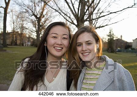 Two university students on campus View Large Photo Image Stock Photograph - Two university students on campus. Fotosearch