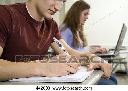 Two university students studying View Large Photo Image Stock Image - Two university students studying. Fotosearch