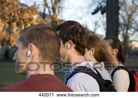 University students listening to music View Large Photo Image Stock Image - University students listening to music. Fotosearch