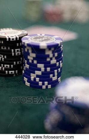 Stock Photo - Piles of gambling chips and playing cards on a table, Las Vegas, Nevada. Fotosearch