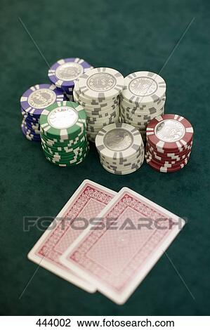 Two playing cards and piles of gambling chips on a table, Las Vegas, Nevada View Large Photo Image Stock Image - Two playing cards and piles of gambling chips on a table, Las Vegas, Nevada. Fotosearch
