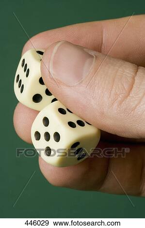 Hand holding two dice View Large Photo Image Stock Photo - Hand holding two dice. Fotosearch