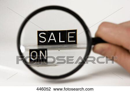 Shop sign viewed through magnifying glass View Large Photo Image Stock Image - Shop sign viewed through magnifying glass. Fotosearch