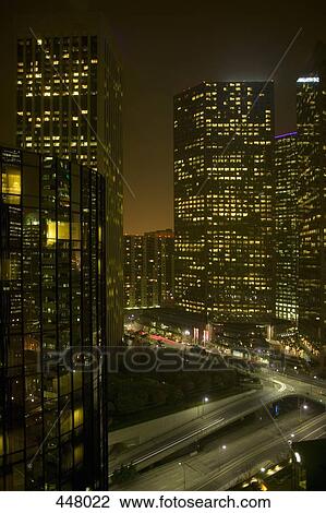 Illuminated skyscrapers and highway at night, Los Angeles, California View Large Photo Image Stock Image - Illuminated skyscrapers and highway at night, Los Angeles, California. Fotosearch