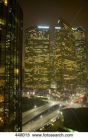 Stock Photography - Illuminated skyscrapers and highway at night, Los Angeles, California. Fotosearch