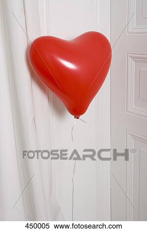 A heart shaped balloon View Large Photo Image Stock Photography - A heart shaped balloon. Fotosearch