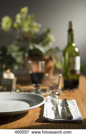 A place setting at a dinner table View Large Photo Image Stock Photo - A place setting at a dinner table. Fotosearch