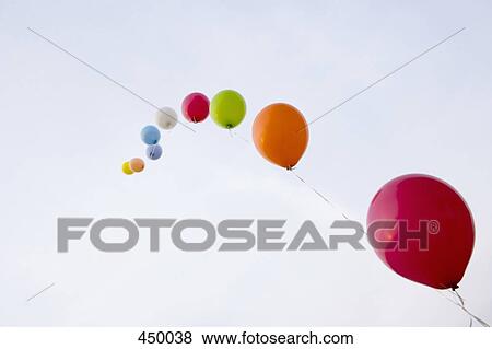 Helium balloons tied to a string View Large Photo Image Stock Photo - Helium balloons tied to a string. Fotosearch