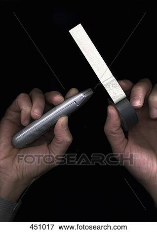 Man cutting duct tape with a utility knife View Large Photo Image Stock Photo - Man cutting duct tape with a utility knife. Fotosearch
