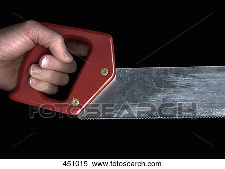 Man holding a saw View Large Photo Image Stock Photography - Man holding a saw. Fotosearch