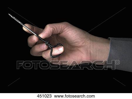 Man holding a small woodworking tool View Large Photo Image Stock Image - Man holding a small woodworking tool. Fotosearch