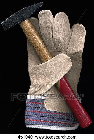 Stock Image - Work glove and a hammer. Fotosearch