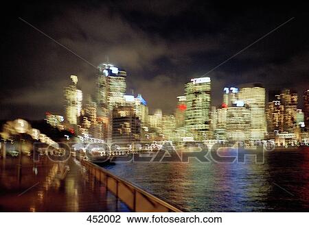Blurred night view of Sydney skyline View Large Photo Image Stock Image - Blurred night view of Sydney skyline. Fotosearch