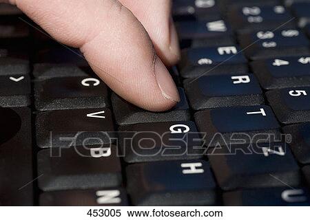 Close-up of a man typing on a laptop keyboard View Large Photo Image Stock Photography - Close-up of a man typing on a laptop keyboard. Fotosearch