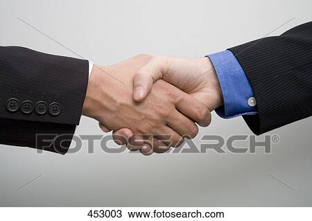 Close-up of two businessmen shaking hands View Large Photo Image Stock Image - Close-up of two businessmen shaking hands. Fotosearch