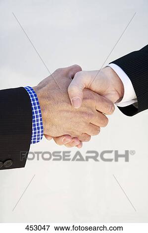 Close-up of two businessmen shaking hands View Large Photo Image Stock Photo - Close-up of two businessmen shaking hands. Fotosearch