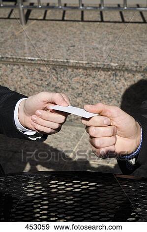Two men exchanging business cards View Large Photo Image Stock Photo - Two men exchanging business cards. Fotosearch