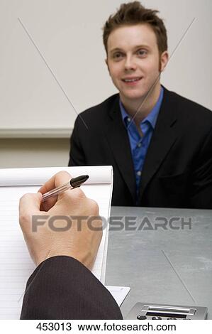 Two men in a business meeting View Large Photo Image Stock Image - Two men in a business meeting. Fotosearch