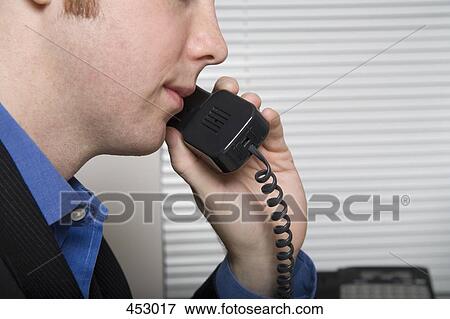 Young businessman on the phone View Large Photo Image Stock Photo - Young businessman on the phone. Fotosearch