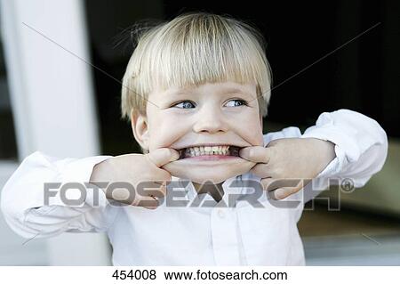 Young boy making a face View Large Photo Image Stock Photo - Young boy making a face. Fotosearch