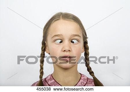 A girl crossing her eyes View Large Photo Image Stock Photo - A girl crossing her eyes. Fotosearch