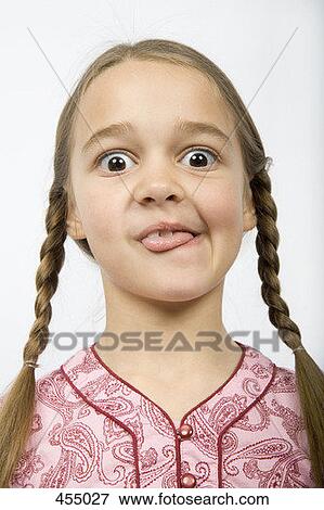 Stock Photo - A girl pulling a funny face. Fotosearch