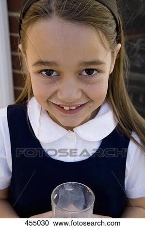 School girl drinking milk View Large Photo Image Stock Image - School girl drinking milk. Fotosearch