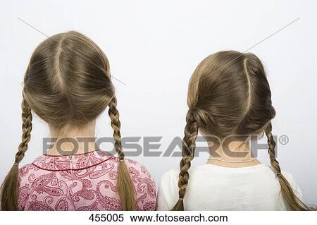 Two girls with pigtails View Large Photo Image Stock Photography - Two girls with pigtails. Fotosearch