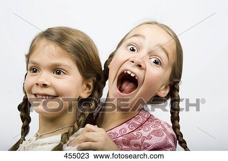 Two young girls messing about View Large Photo Image Stock Image - Two young girls messing about. Fotosearch