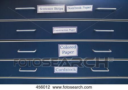 Stock Image - A blue chest of drawers in a classroom. Fotosearch
