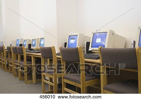 A row of computers in school library View Large Photo Image Stock Image - A row of computers in school library. Fotosearch