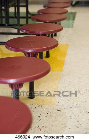 A row of stools in school canteen View Large Photo Image Picture - A row of stools in school canteen. Fotosearch