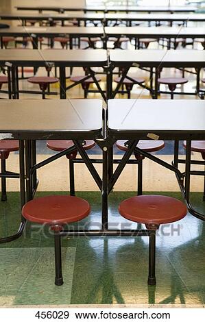 Rows of stools and tables in school canteen View Large Photo Image Stock Photo - Rows of stools and tables in school canteen. Fotosearch