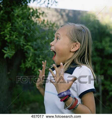 Stock Photo - Girl looking surprised. Fotosearch