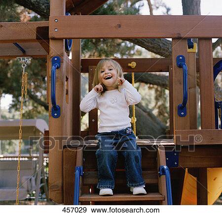 Stock Photo - Young girl in a playground. Fotosearch