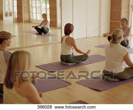 Stock Photo - A yoga class. Fotosearch