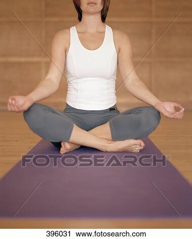 Woman in the lotus position View Large Photo Image Stock Image - Woman in the lotus position. Fotosearch