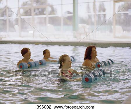 Women doing a water aerobics class View Large Photo Image Stock Image - Women doing a water aerobics class. Fotosearch