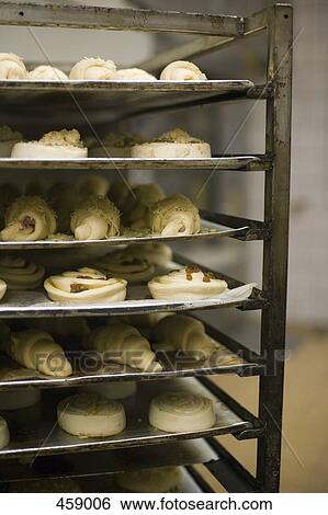 Trays of uncooked pastries View Large Photo Image Stock Photograph - Trays of uncooked pastries. Fotosearch